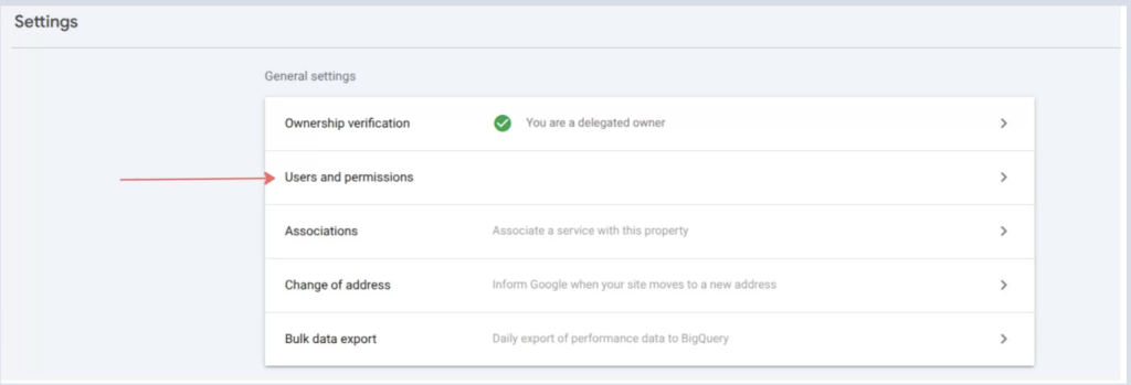 Screenshot of the Google Search Console Settings page with the Users and permissions option highlighted by a red arrow. The page also displays ownership verification, associations, change of address, and bulk data export settings, showing where to manage user access and permissions for a Search Console property.