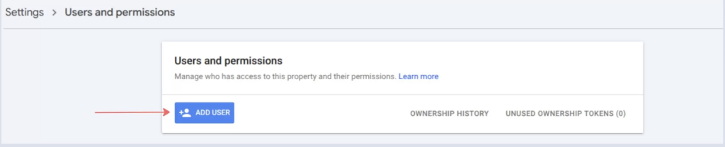Screenshot of the Google Search Console Users and permissions page with the blue Add User button highlighted by a red arrow. The page shows where website owners can grant access to additional users and manage Search Console permissions.